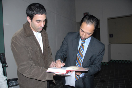 Dr. Trita Parsi signs a copy of his book 'Treacherous Alliance' for a fan - Beverly Hills - by QH