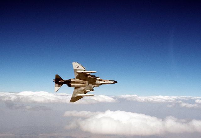 An underside view of an F-4 Phantom II aircraft banking sharply to the right during exercise Cento. (August 1, 1977)