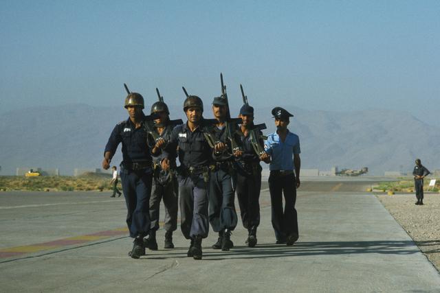 Iranian military police prepare to change the guard at Shiraz Air Base. Because of the extreme heat, the guard was rotated frequently during Exercise CENTO. (August 1, 1977)
