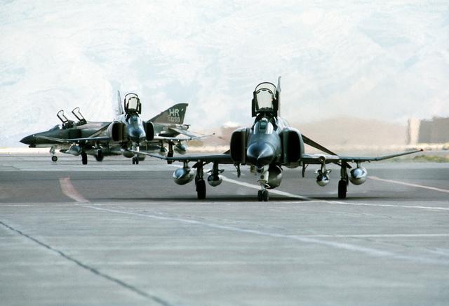  view of three F-4 Phantom II aircraft parked at Shiraz Air Base during exercise Cento. (August 1, 1977)