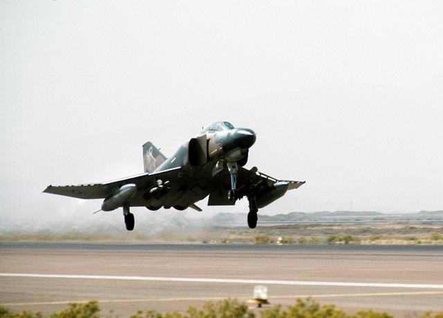 A right front view of an F-4 Phantom II aircraft taking off from Shiraz Air Base during exercise Cento. (August 1, 1977)