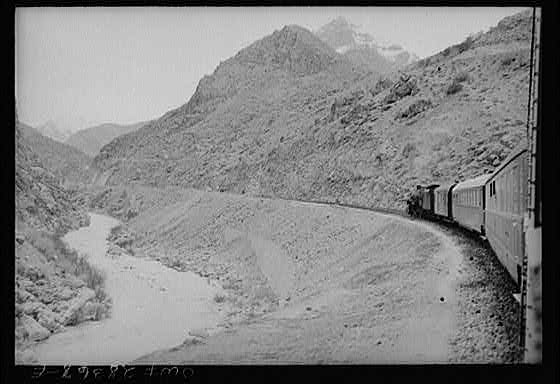 Mountainous route of trains carrying supplies to Russia. An American engine with an American crew is going along a gorge through the ever-winding route somewhere in Iran.