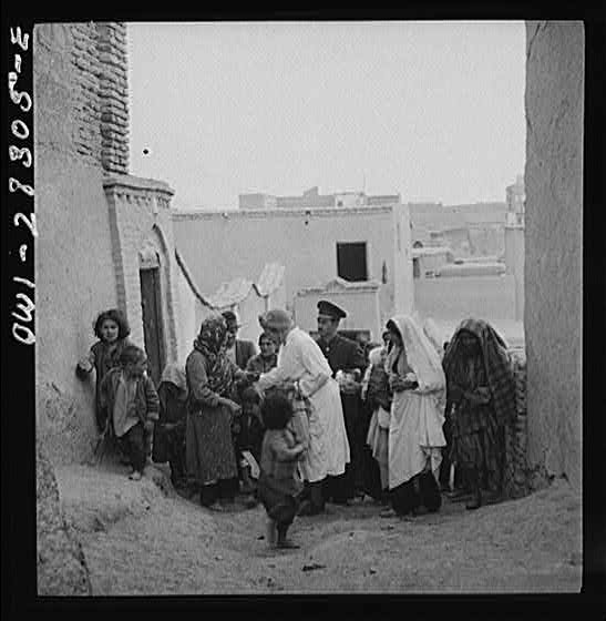 Teheran, Iran. Mrs. Louis Dreyfus, wife of the United States minister to Iran touring the poorer section of the city
