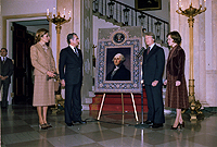 The Shah of Iran and the Shahbanou of Iran present Jimmy Carter and Rosalynn Carter with a tapestry of George Washington., 11/15/1977 - ARC Identifier: 176853.