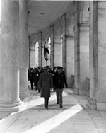 The Shah of Iran (left) walking at the front procession of unidentified military personnel at an unknown monument in Washington, D.C.