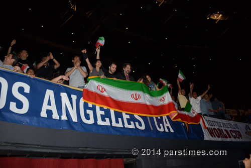 Fans cheering the Iranian wrestling team