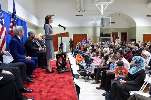 UNHCR Special Envoy Jolie Pitt (Angelina Jolie) speaks with U.S. Secretary of State John Kerry present at an Interfaith Iftar Reception to Mark World Refugee Day - Dulles Area Muslim Society in Sterling, Virginia - USDOS Photo (June 20, 2016)