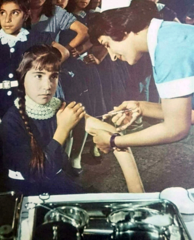 A nurse vaccinating a child