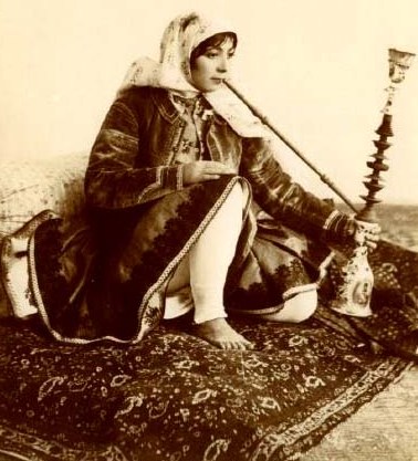 Qajar Woman smoking the traditional Qalyan