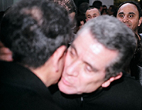 Behrouz Vosoghi embracing Mohammad Reza Shajarian - by QH