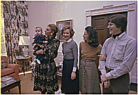 The Shahbanou of Iran holds Jimmy Carter IV while Rosalynn Carter, Caron Carter and Chip Carter watch., 01/18/1978  - ARC Identifier: 177649.