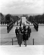 The Shah of Iran (front left), followed by a military procession, after laying a wreath at the Tomb of the Unknown Soldier at Arlington National Cemetery.- November 18, 1949.