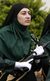 Female police officer holds a rifle
