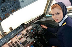 A female pilot wearing a loose scarf - Fars News